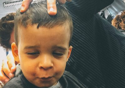 Its been a few weeks since your last haircut. You used to go to daddy's hair stylist (Lori) in Queens but since daddy's schedule at work changed we can't go there anymore. Lori only works on Saturdays. Dad found a new place in the city so mommy has a choice of either going to Queens or find someone nearby. And that's exactly what mommy did. She took you to a local neighborhood location named Jacobs Barber Shop in Bellmore. I was told that you really enjoyed the entire process of getting your haircut. You were never a problem for Lori. Everyone always wondered how well you handled getting a haircut at such a young age. So mommy dropped off Annelise at school and with Paula they took you for a much needed haircut. Upon your request you wanted Paula to sit with you as you received your knew "dew."